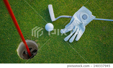 Golf balls on a green lawn in a beautiful golf course with morning sunshine. Golf balls on a green lawn in a beautiful golf course with morning sunshine. 140337945
