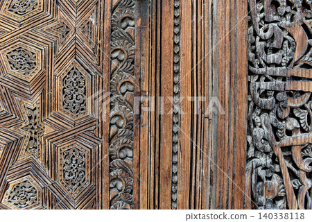 Carved wooden door details with geometric patterns, Bou Inania Madrasa. Fez, Morocco Carved wooden door details with geometric patterns, Bou Inania Madrasa. Fez, Morocco 140338118