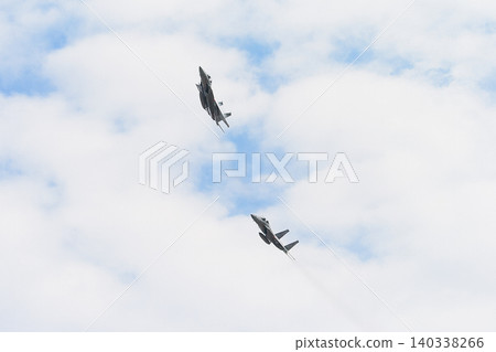 A formation of Japan Air Self-Defense Force F-15DJ Eagles circling. A formation of Japan Air Self-Defense Force F-15DJ Eagles circling. 140338266