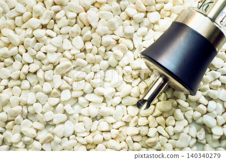 Drink coffee and tea. Sugar dispenser on white stones pebbles Drink coffee and tea. Sugar dispenser on white stones pebbles 140340279