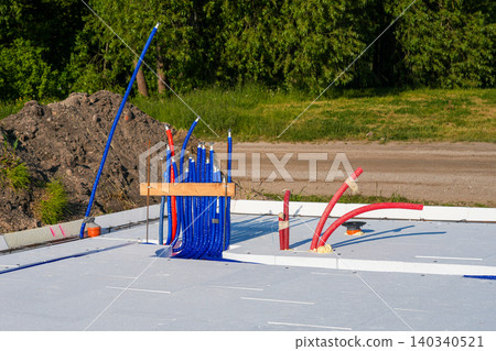 Underfloor heating manifold connections and utility outputs on insulated slab foundation construction 140340521