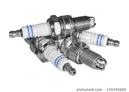 Heap of new motor car candles on a white background Heap of new motor car candles on a white background 140340888