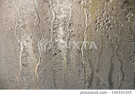 Condensation and water droplet texture on window glass Condensation and water droplet texture on window glass 140341505