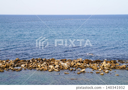 The rocky reefs of Amaharashi Coast and the calm seascape of Toyama Bay The rocky reefs of Amaharashi Coast and the calm seascape of Toyama Bay 140341932