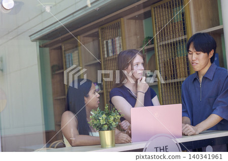 Men and women having a meeting in a coworking space 140341961