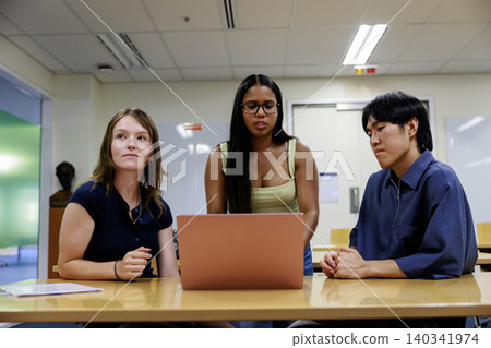 Young company employees having a meeting with an international team. Young company employees having a meeting with an international team. 140341974