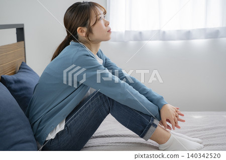 Woman worried about bed 140342520