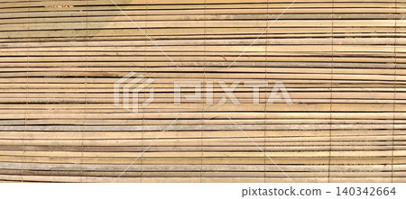 Natural bamboo mat texture with horizontal wood stripes. Natural bamboo mat texture with horizontal wood stripes. 140342664