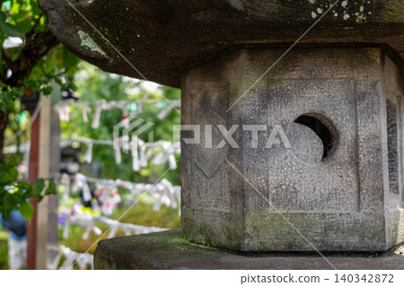 A shrine scene with stone lanterns A shrine scene with stone lanterns 140342872