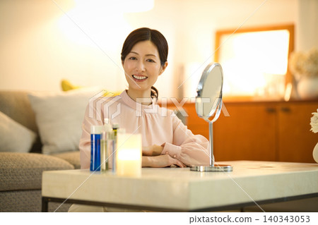 Middle-aged women doing their nighttime skincare routine Middle-aged women doing their nighttime skincare routine 140343053