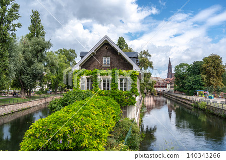 House covered with green ivy by the canal Strasbourg, France 140343266