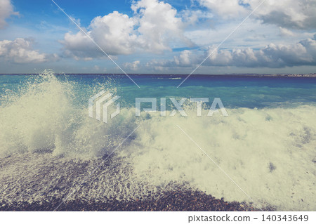 Waves rolling on a pebble beach on the Cote d'Azur 140343649