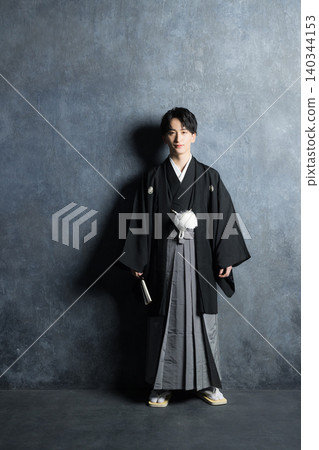 A young man in a hakama with family crest A young man in a hakama with family crest 140344153