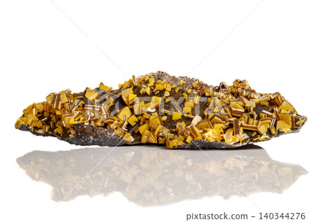 Macro mineral stone yellow Wulfenite on a white background Macro mineral stone yellow Wulfenite on a white background 140344276