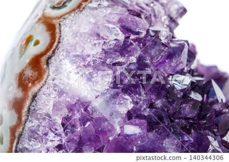 Amethyst Crystal Druse macro mineral on white background Amethyst Crystal Druse macro mineral on white background 140344306