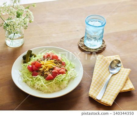 Taco rice, wooden table dining styling, cafe-style lunch 140344350