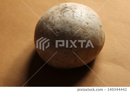 round stone on colored background round stone on colored background 140344442