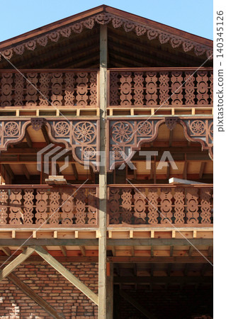 Balcony architectural detail. Wooden garden house. Balcony architectural detail. Wooden garden house. 140345126