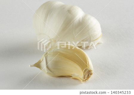 garlic clove on a white background garlic clove on a white background 140345233