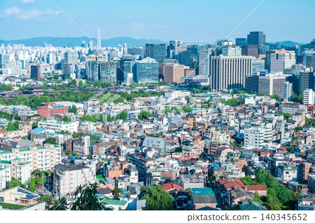 Panoramic view of downtown Seoul city skyline and Namsan Seoul Tower from Inwangsan Mountain on a clear summer day Panoramic view of downtown Seoul city skyline and Namsan Seoul Tower from Inwangsan Mountain on a clear summer day 140345652