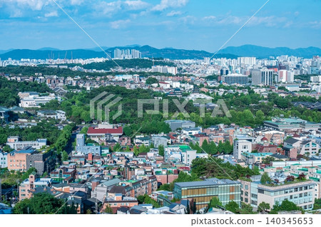 Panoramic view of downtown Seoul city skyline and Namsan Seoul Tower from Inwangsan Mountain on a clear summer day Panoramic view of downtown Seoul city skyline and Namsan Seoul Tower from Inwangsan Mountain on a clear summer day 140345653