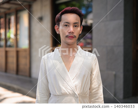 Thai Non-Binary Gay Man Outside Modern Cafe Portrait Thai Non-Binary Gay Man Outside Modern Cafe Portrait 140346033