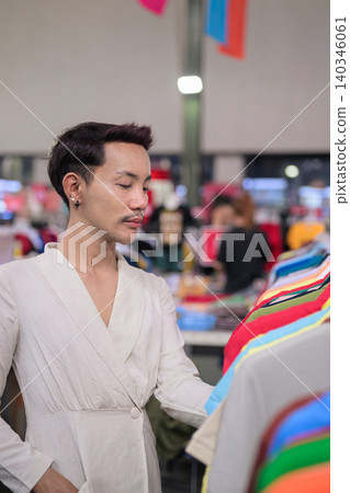 Thai Non-Binary Gay Man Browsing Clothes Vertical Portrait Thai Non-Binary Gay Man Browsing Clothes Vertical Portrait 140346061