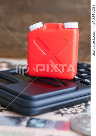 Kerosene can and calculator - Image of kerosene prices and heating costs 140346282