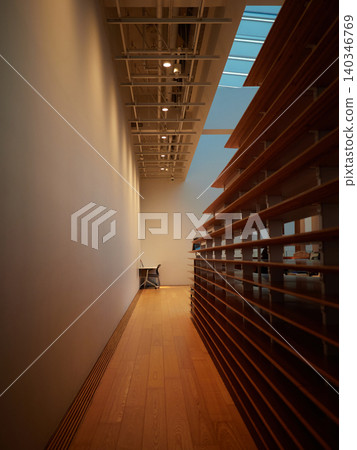A corridor inside the Toyama Library and a view of a user. A corridor inside the Toyama Library and a view of a user. 140346769