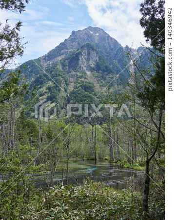 The scenery of the Dakesawa Marshland in Kamikochi, a popular tourist spot in early summer. The scenery of the Dakesawa Marshland in Kamikochi, a popular tourist spot in early summer. 140346942