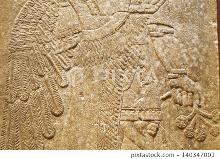 Assyrian Winged Figure Relief Fragment Assyrian Winged Figure Relief Fragment 140347001
