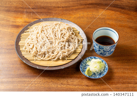 Zaru Soba: A classic Japanese noodle dish served cold and refreshing, eaten by dipping the noodles in a dipping sauce. Zaru Soba: A classic Japanese noodle dish served cold and refreshing, eaten by dipping the noodles in a dipping sauce. 140347111