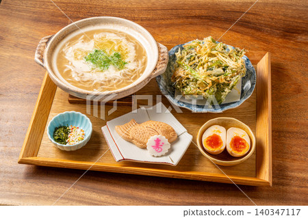Tai Paita Soba: A luxurious Japanese noodle dish featuring a rich and creamy broth made with sea bream. Tai Paita Soba: A luxurious Japanese noodle dish featuring a rich and creamy broth made with sea bream. 140347117