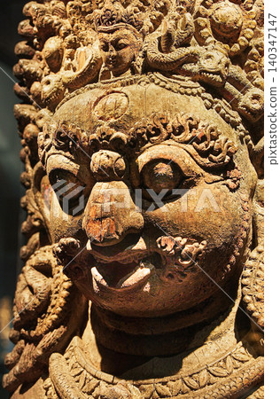 Bhairava, Popular God In Nepal, Is Ferocious Form Of Shiva. Wooden Statue Of Mahabhairava. He Assumes This Form To Destroy Evil. Large And Impressive Heads Of Bhairava Adorning The Entrances Of Bhairava, Popular God In Nepal, Is Ferocious Form Of Shiva. Wooden Statue Of Mahabhairava. He Assumes This Form To Destroy Evil. Large And Impressive Heads Of Bhairava Adorning The Entrances Of 140347147