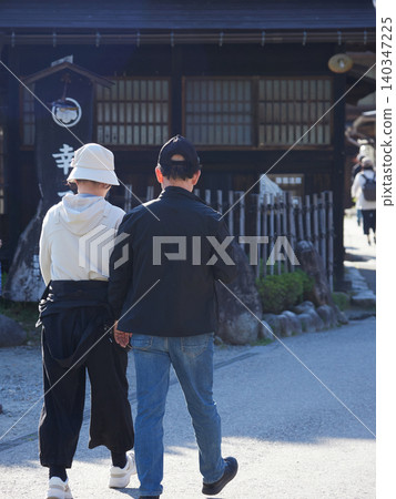 A scene of many tourists in Shirakawa-go, a popular tourist spot in spring. A scene of many tourists in Shirakawa-go, a popular tourist spot in spring. 140347225