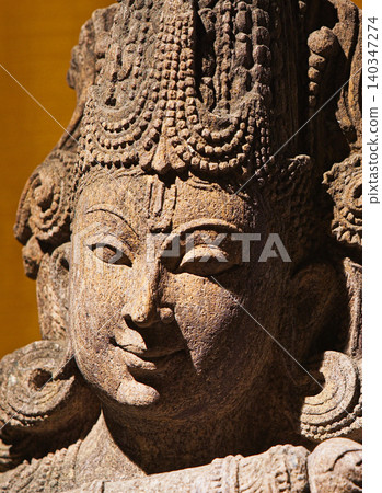 Close-up view on Statue Of Krishna Playing Flute. He Is God Of Protection, Compassion, Tenderness, And Love. Krishna Is Major Deity In Hinduism Close-up view on Statue Of Krishna Playing Flute. He Is God Of Protection, Compassion, Tenderness, And Love. Krishna Is Major Deity In Hinduism 140347274