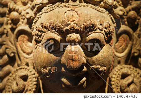 Bhairava, Popular God In Nepal, Is Ferocious Form Of Shiva. Wooden Statue Of Mahabhairava. He Assumes This Form To Destroy Evil. Large And Impressive Heads Of Bhairava Adorning The Entrances Of Bhairava, Popular God In Nepal, Is Ferocious Form Of Shiva. Wooden Statue Of Mahabhairava. He Assumes This Form To Destroy Evil. Large And Impressive Heads Of Bhairava Adorning The Entrances Of 140347433