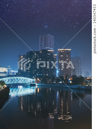 Waibaidu Bridge and city buildings reflecting in Suzhou Creek at night. Waibaidu Bridge and city buildings reflecting in Suzhou Creek at night. 140347453