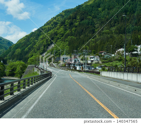 A rural road scene in Nagano Prefecture, Japan, in early summer. A rural road scene in Nagano Prefecture, Japan, in early summer. 140347565