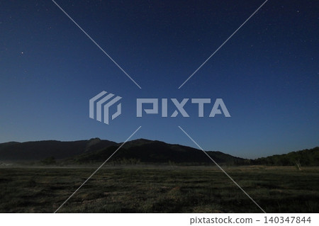 Moonlight over Oze Marshland, with a panoramic view and the night sky. Moonlight over Oze Marshland, with a panoramic view and the night sky. 140347844