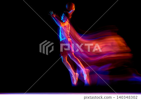 Neon basketball player jumping with ball and red blue motion trails. Neon basketball player jumping with ball and red blue motion trails. 140348302