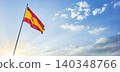 Flag of Spain waving at the top of a post with a bottom of sunny blue sky 140348766