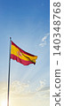 Flag of Spain waving at the top of a post with a bottom of sunny blue sky 140348768