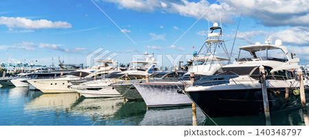 Summer vacation. Luxury marina. Motorboat yacht sailing at sea. Yachting boat tourism. Motorboat sea marina. Luxury yacht marina. Docked luxurious yacht boat. Luxury lifestyle. Stunning view Summer vacation. Luxury marina. Motorboat yacht sailing at sea. Yachting boat tourism. Motorboat sea marina. Luxury yacht marina. Docked luxurious yacht boat. Luxury lifestyle. Stunning view 140348797