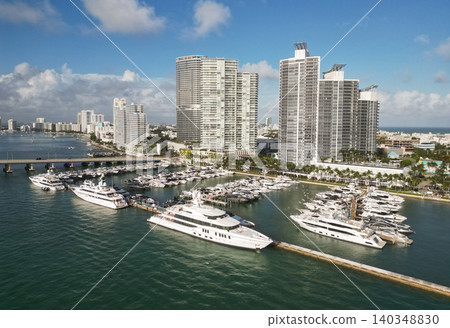 Luxurious lifestyle. View of luxury Miami Florida. Summer vacation. Marina dock. Luxury South beach marina. Miami south beach view. Docked luxurious yacht boat. Sailing at the marina Luxurious lifestyle. View of luxury Miami Florida. Summer vacation. Marina dock. Luxury South beach marina. Miami south beach view. Docked luxurious yacht boat. Sailing at the marina 140348830