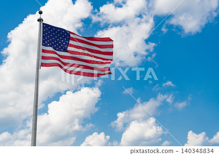 Independence day. Patriotic symbol. American Flag for Memorial Day or 4th of July. American flag waving, labor day. Flag of the USA. National waving flag of united states on blue sky Independence day. Patriotic symbol. American Flag for Memorial Day or 4th of July. American flag waving, labor day. Flag of the USA. National waving flag of united states on blue sky 140348834