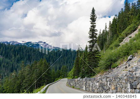 North Cascades nation park. Road leads to Diablo lake with mountain landscape. Landscape of mountain and road. Travel destination. Landscape route to North Cascades National Park. Scenic nature North Cascades nation park. Road leads to Diablo lake with mountain landscape. Landscape of mountain and road. Travel destination. Landscape route to North Cascades National Park. Scenic nature 140348845