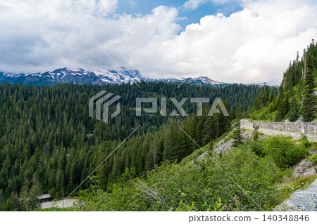 Serene countryside scenery. Scenic green hill mountain. Summer day in wild mountain with coniferous forest and green slopes. Mountain landscape with meadow. Mountainous landscape with cloudy sky Serene countryside scenery. Scenic green hill mountain. Summer day in wild mountain with coniferous forest and green slopes. Mountain landscape with meadow. Mountainous landscape with cloudy sky 140348846