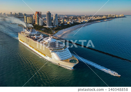 Cruise ship tour and travel at sea. Aerial view of luxury liner voyage. Ship leaving Miami beach port. Miami tour. Cruise ship voyage. Aerial view of cruise in summer vacation Cruise ship tour and travel at sea. Aerial view of luxury liner voyage. Ship leaving Miami beach port. Miami tour. Cruise ship voyage. Aerial view of cruise in summer vacation 140348858