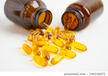 Fish oil or Cod liver oil gel in capsules with omega 3 vitamins, supplementary healthy food. 140348972